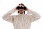 Smiling  Male Watching Through Binocular Stock Photo