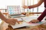 Two Young Men Working As Fashion Designers And Drawing Sketches Stock Photo