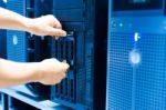 Man Fix Server Network In Data Center Room Stock Photo