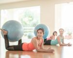 Asian Woman Doing Yoga Indoors Stock Photo