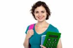 Female Student Holding Education Accessories Stock Photo