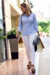 Beautiful Young Woman Walking In The Street. Shopping Concept Stock Photo