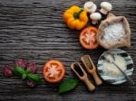 The Ingredients For Homemade Pizza On Shabby Wooden Background Stock Photo