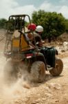 People Riding Quad Bike Stock Photo