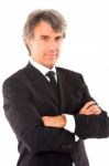 Businessman With Arms Crossed Stock Photo