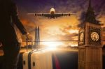 Young Business Man Standing With Luggage On Urban Airport Runway Stock Photo