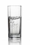 Water With Air Bubbles In A Tall Glass With Its Reflection Isola Stock Photo