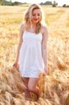 Portrait Of Beautiful Girl In Field Stock Photo