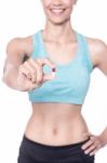 Female Trainer Showing A Pill Stock Photo