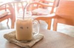 Iced Milk Coffee Glass On Wooden Table With Vintage Filter Effec Stock Photo