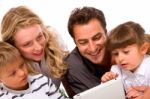 Family Using Digital Tablet Stock Photo