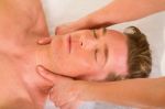 Man Receiving Neck Massage Stock Photo