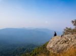 Young Man  Asia Tourist  At Mountain Is Watching Over The Misty Stock Photo