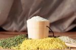 Rice And Nuts On Table Stock Photo