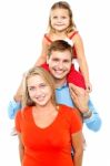 Portrait Of Cheerful Family Of Three Having Fun Stock Photo