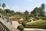 Enchanted Ajuda Garden With April 25th Bridge In Lisbon, Portugal Stock Photo