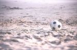 Football On Sandy Beach Stock Photo