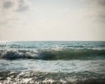 Sea With Surf And Cloudy Sky Stock Photo