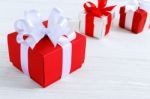 Red Gift Box With White Ribbon Stock Photo