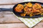 Delicious Baked Chicken Thighs With Lemon Slices, Onion And Zucchini Stock Photo