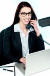 Female Executive Speaking On Phone Stock Photo