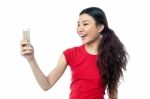 Amused Girl Clicking A Selfie Stock Photo