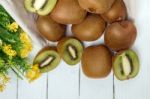 Tasty Kiwi Fruits Isolated On A White Wooden Background Stock Photo