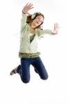 Lady Jumping While Listening Music Stock Photo