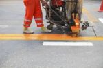 Machine And Worker At Road Construction Stock Photo