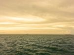 Landscape Of Sea With Boat And Fishing Men And Blue Sky Stock Photo