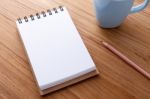 Blank Notebook On Wood Table Stock Photo