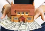 House And Dollar Bills Stock Photo