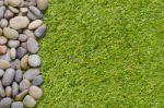 Stone On Grass Background Stock Photo