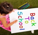 Little Girl Writing Back To School Stock Photo