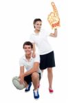 Cheerleader Fan Girl Posing With Football Team Player Stock Photo