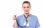 Female Doctor Posing With Stethoscope Stock Photo