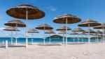 Parasols At Liscia Ruja Beach In Sardinia Stock Photo