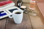 White Cup Hot Black Coffee On Wood Table With Working Women Thin Stock Photo