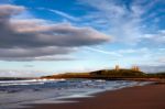 View Of Dunstanburgh Castle At Craster Northumberland Stock Photo