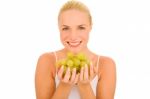 Woman Holding Grapes Stock Photo