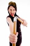 Violent Young Female Holding Nunchaku Stock Photo