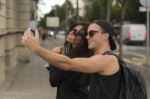 Young Couple Taking Selfies Stock Photo