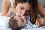 Mother And Baby Playing And Smiling At Home Stock Photo