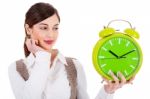 Woman Holding Clock Stock Photo