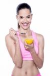 Smiling Fit Woman Having An Orange Stock Photo