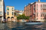 Motorboat Cruising Down The Grand Canal In Venice Stock Photo