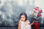 Girl With A Vase Of Flowers Stock Photo