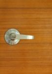 Metallic Silver Knob On Wooden Door Stock Photo