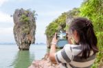 Female Traveler Shooting Natural View By Mobile Phone Stock Photo