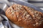 Dark Multigrain Bread Whole Grain Fresh Baked On Rustic Closeup Stock Photo